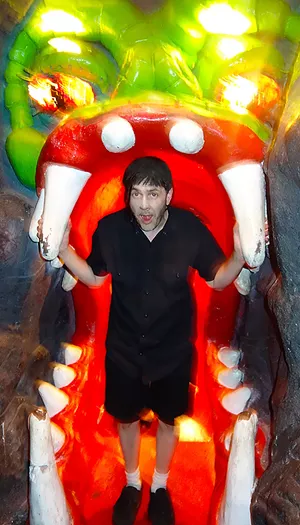 Man inside mouth of dragon