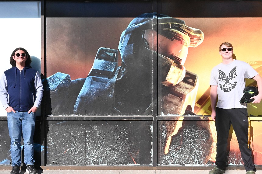 Two Halo fans honor an aging mural.