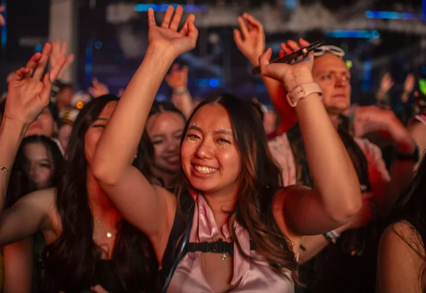woman dancing with hands in the air