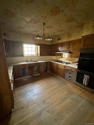 A destroyed, outdated kitchen.