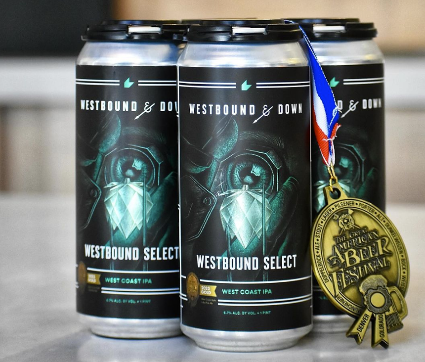 Four pack of beer with an award medal.