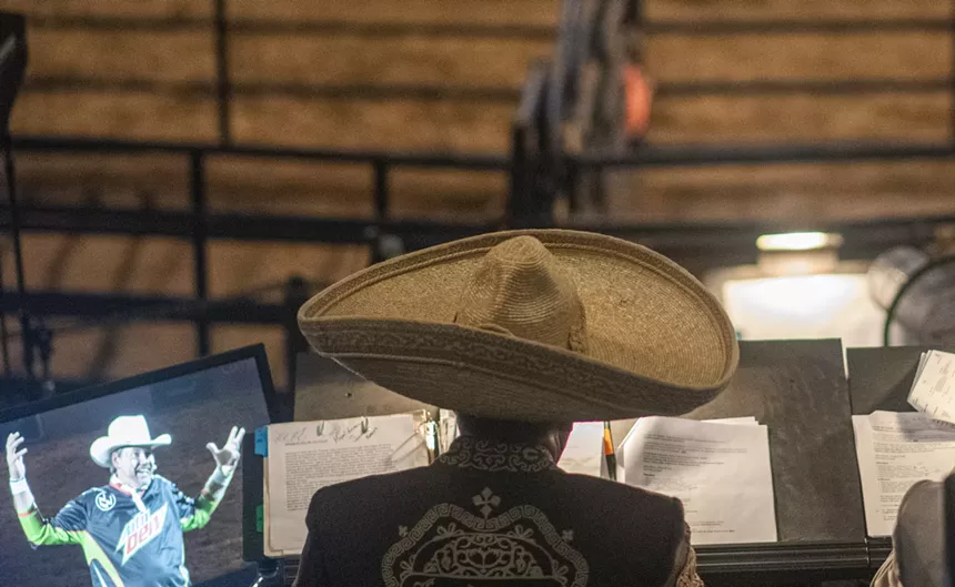 back of man in big sombrero