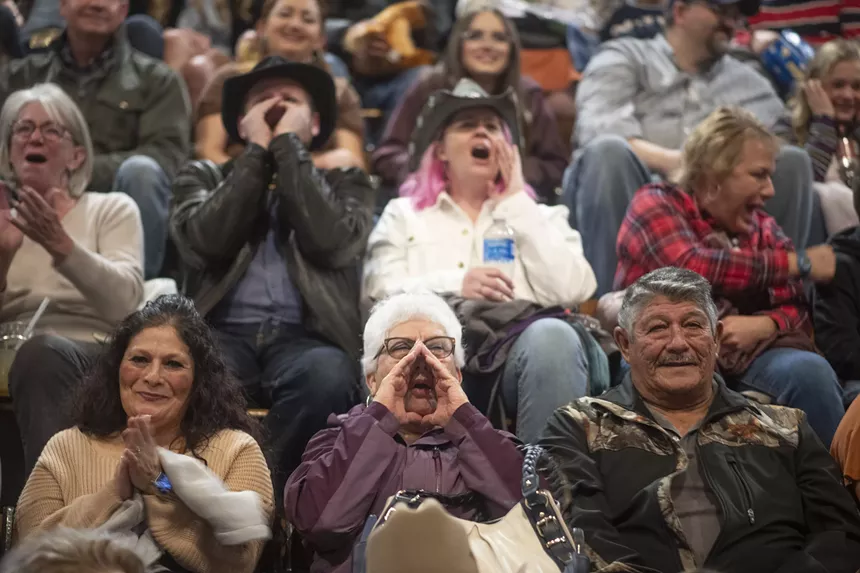 crowd of people at rodeo.