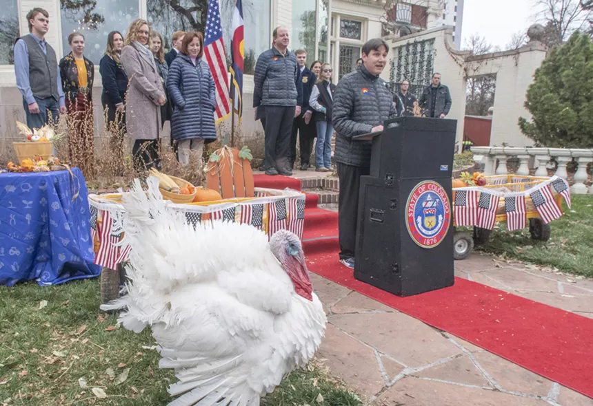 man at podium, with turkey