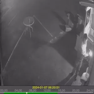 man burning a building with blowtorch