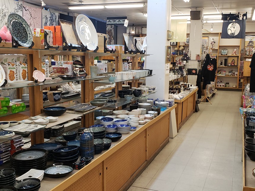 various kitchen ware on shelves in a store