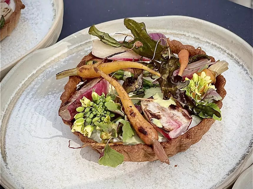 Vegetable tart on a plate.