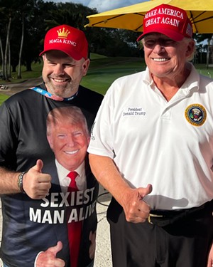 Trent Leisy posing for a picture with Donald Trump.