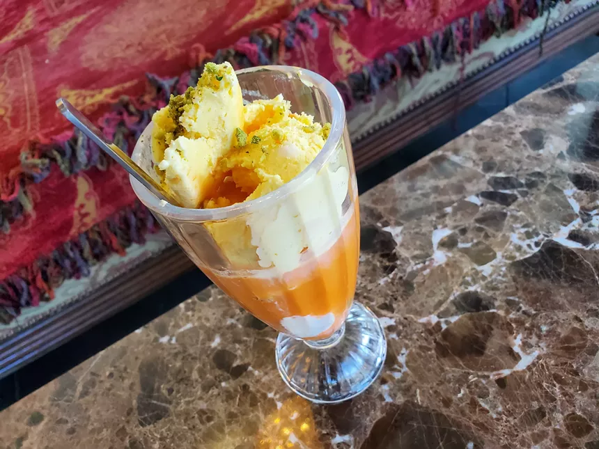 an ice cream float in carrot juice