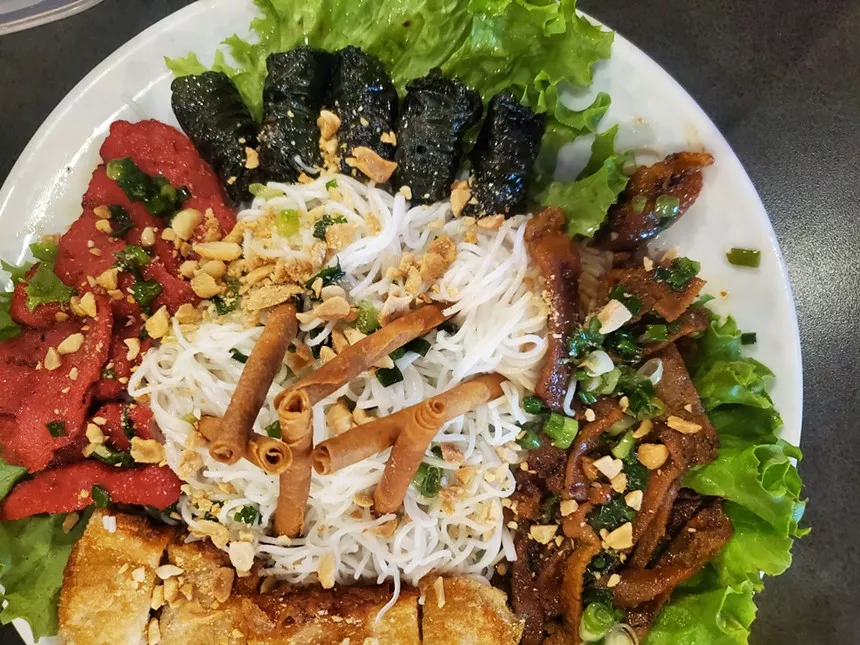 a platter of rice noodles and various meats