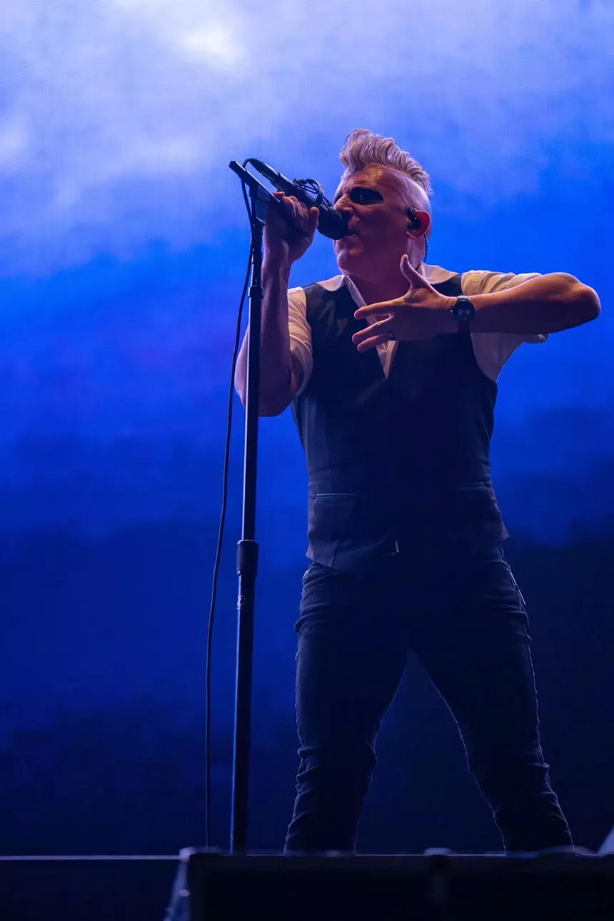 man singing into microphone