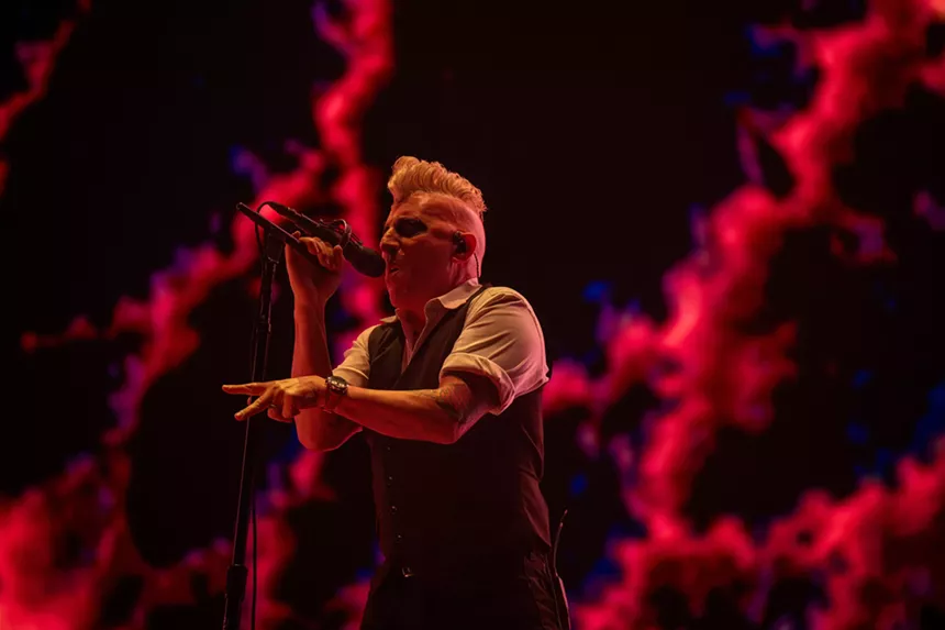 man singing into microphone