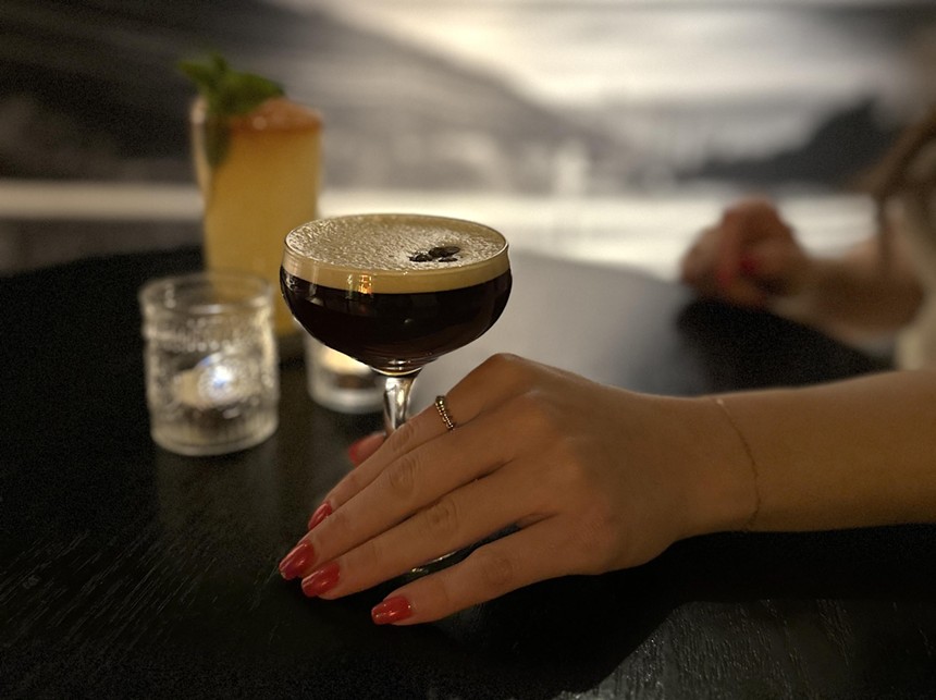 hand holding an espresso martini