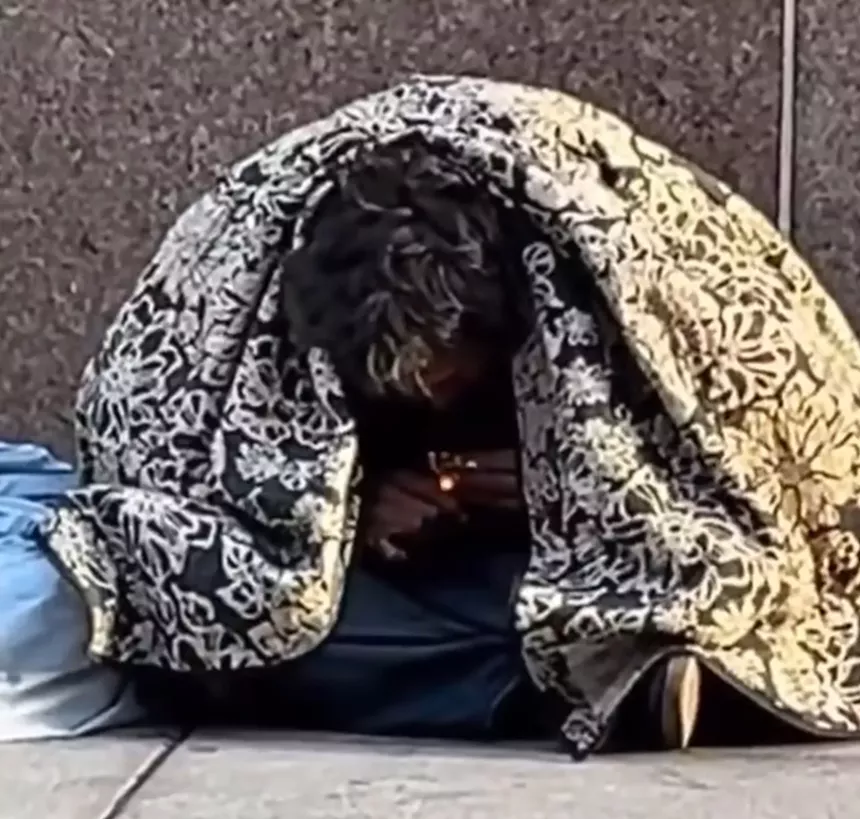 A man smokes what appears to be crack in downtown Denver.