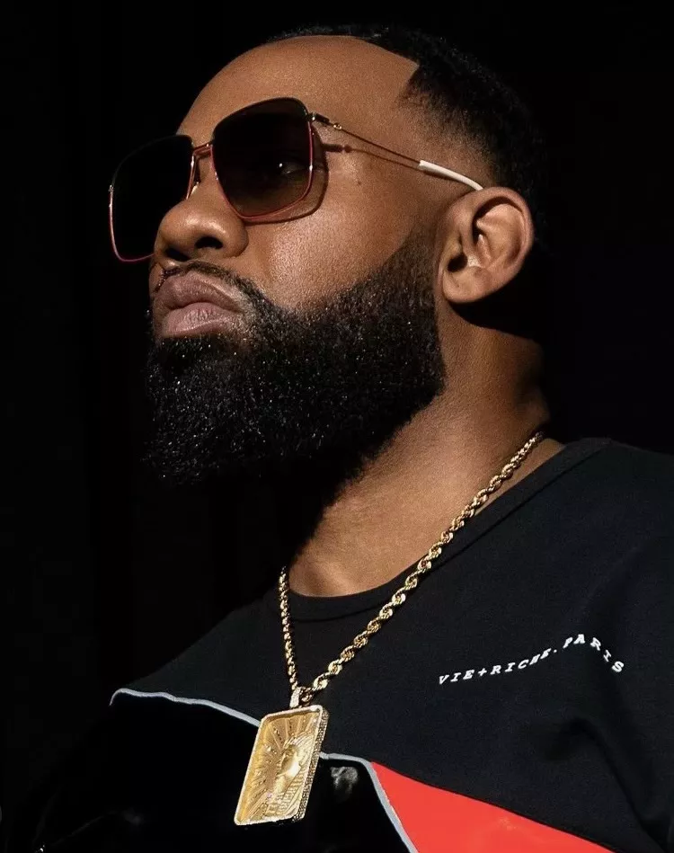 rapper in sunglasses and leather jacket