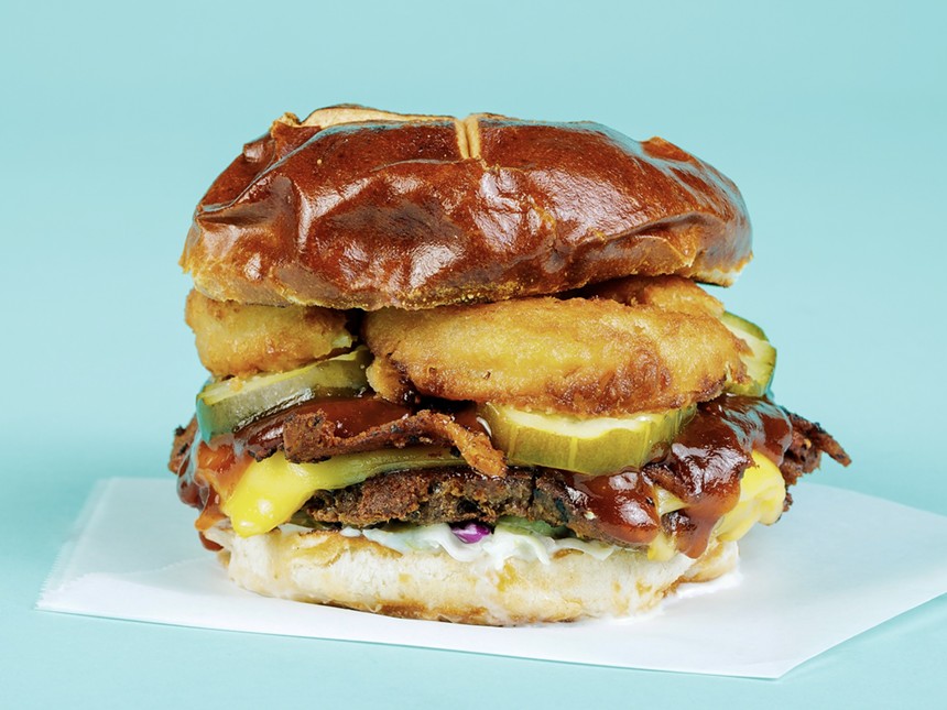 Native Foods' plant-based BBQ brisket burger on a blue backdrop