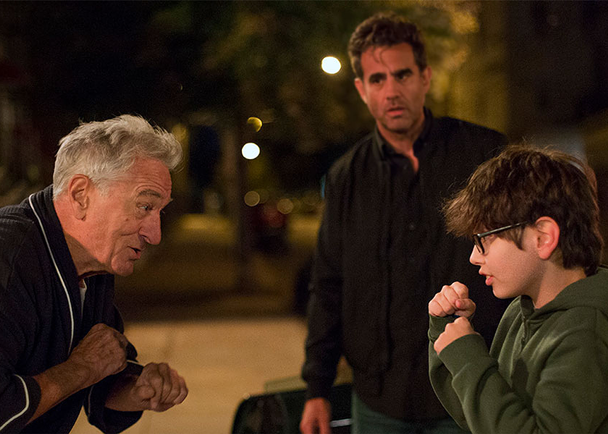 two men and a boy talking