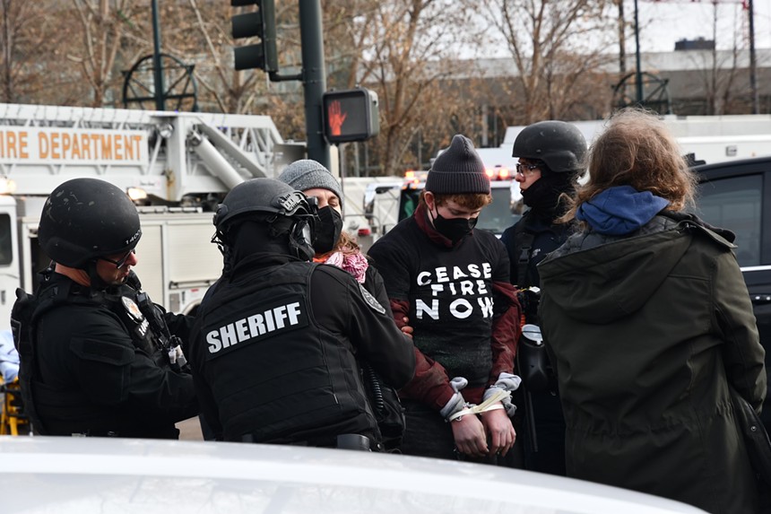 Saoirse Maloney and other JVP protesters being arrested by Denver police.