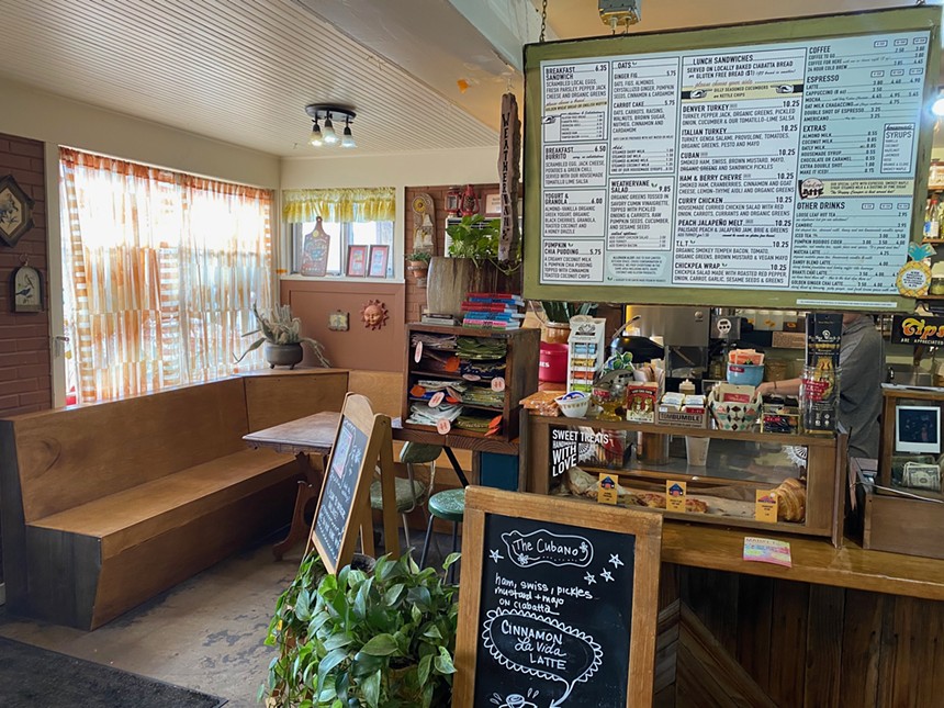 interior of a cafe with a menu baord