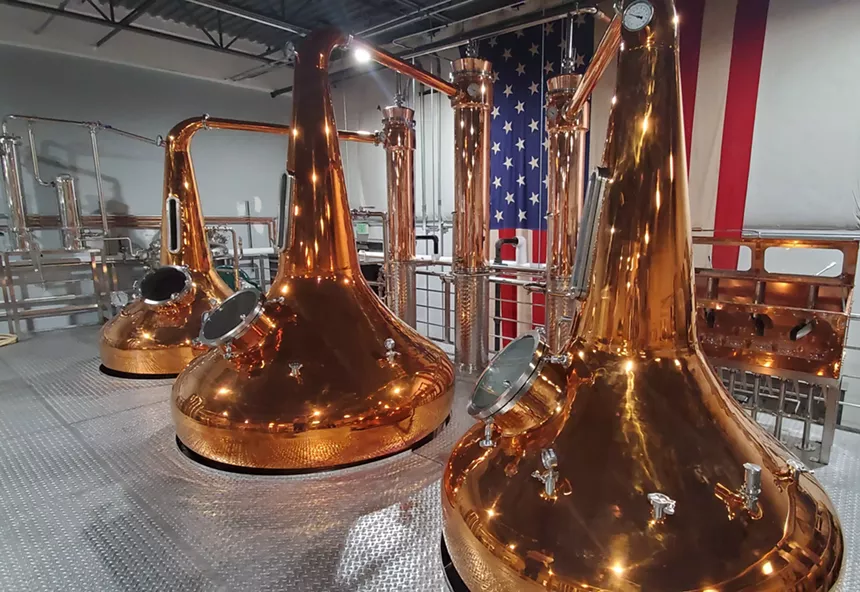 three copper stills