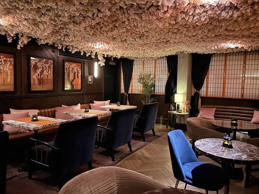 Cherry blossoms and comfortable seating within Sakura Blossom Bar