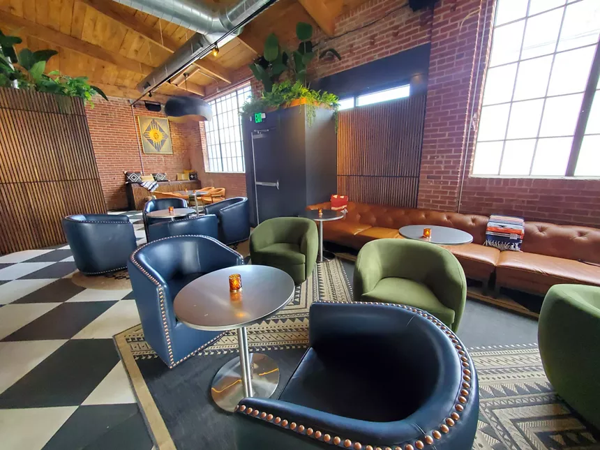 chairs and couches inside a bar