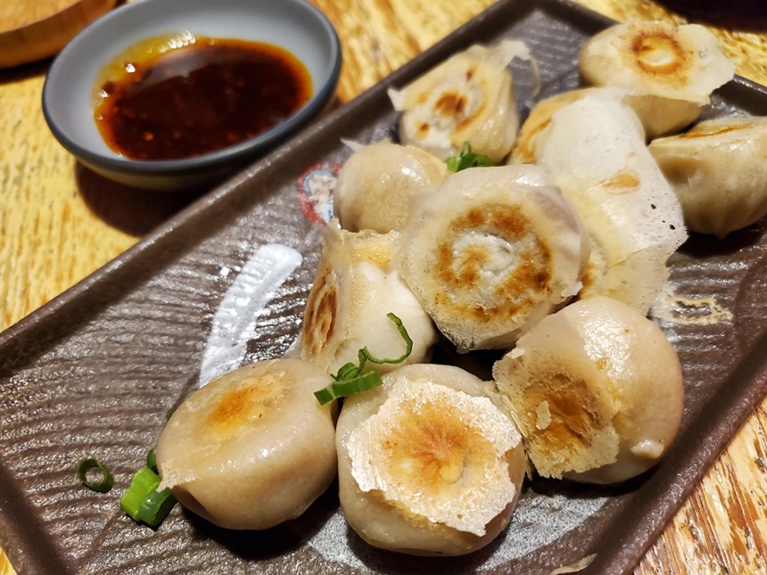 a plate of small round dumplings