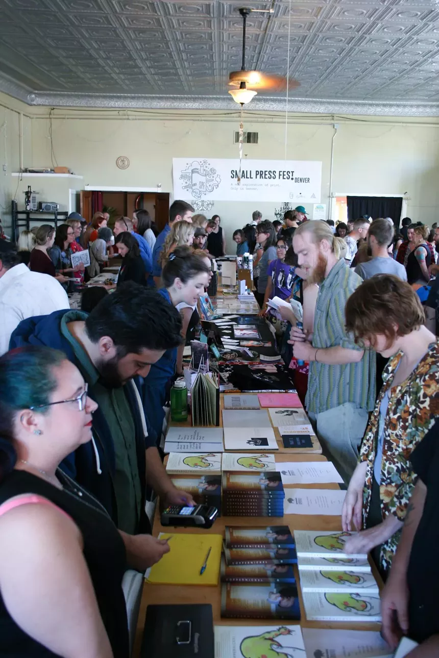 people at tables selling prins
