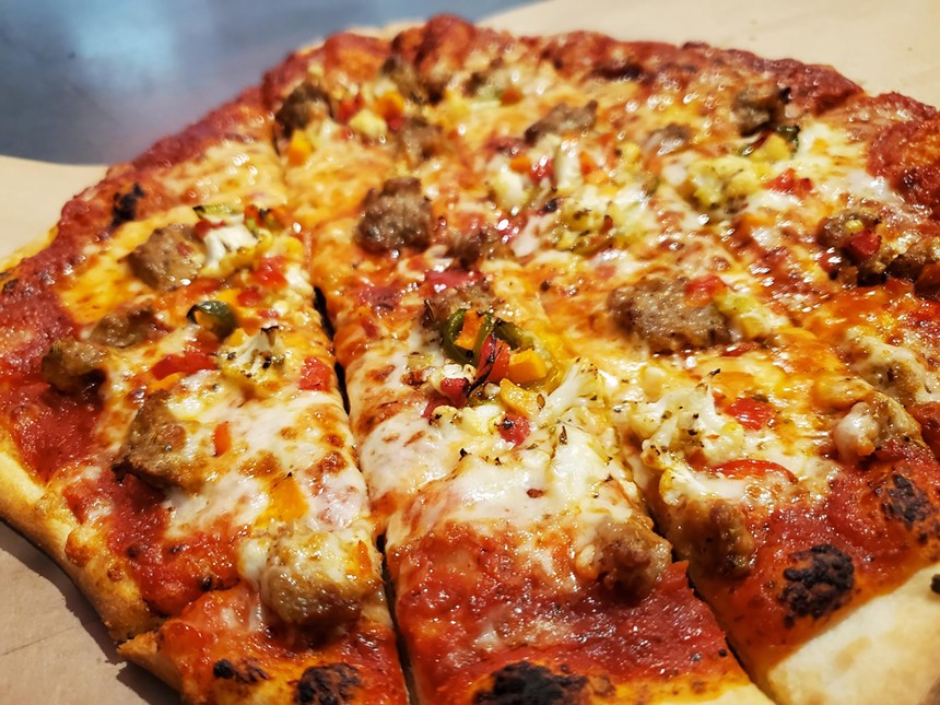 a pizza topped with sausage and giardiniera