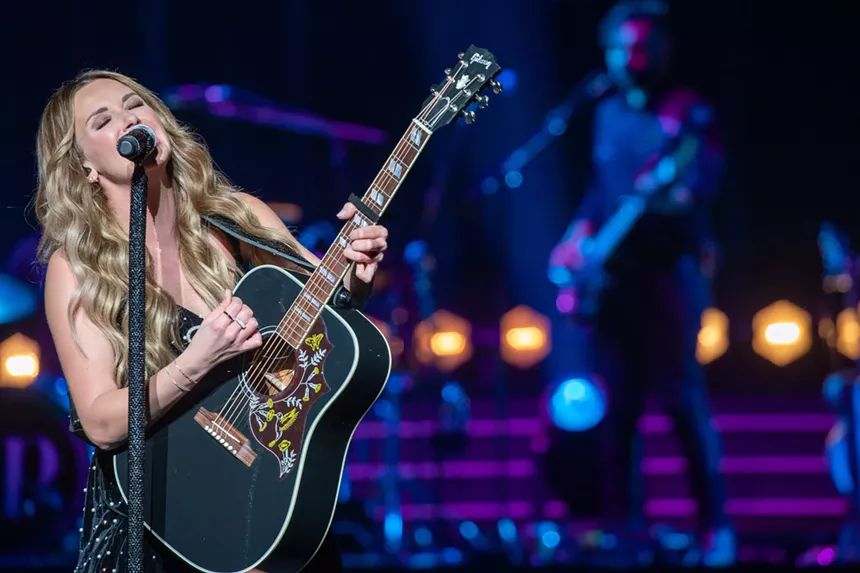 woman playing guitar