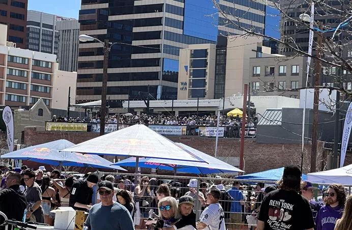 People celebrating Opening Day for the Colorado Rockies.