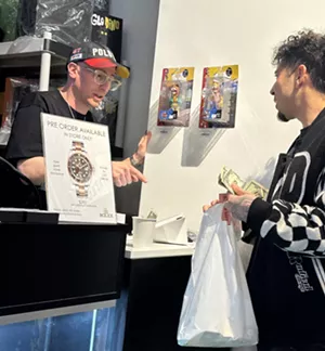 A person buying items from the Elbo Store in Denver, Colorado.