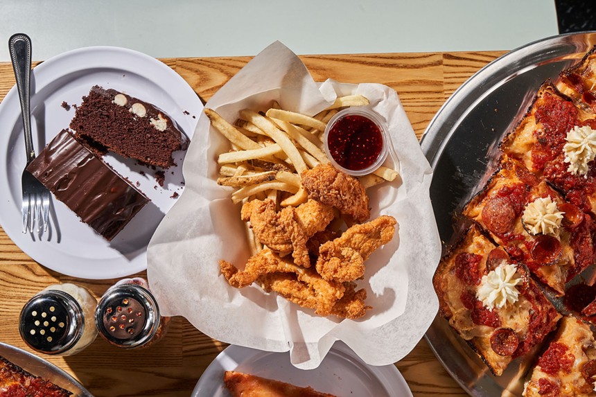 chocolate cake, chicken tenders and fries and a pepperoni pizza