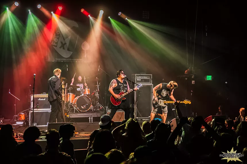 punk band performing on stage