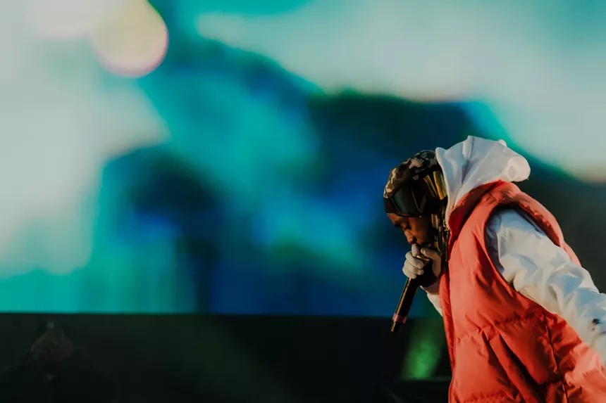 man rapping into a microphone