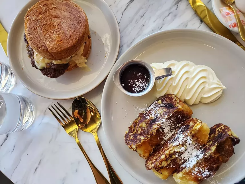 french toast and a burger on a croissant bun