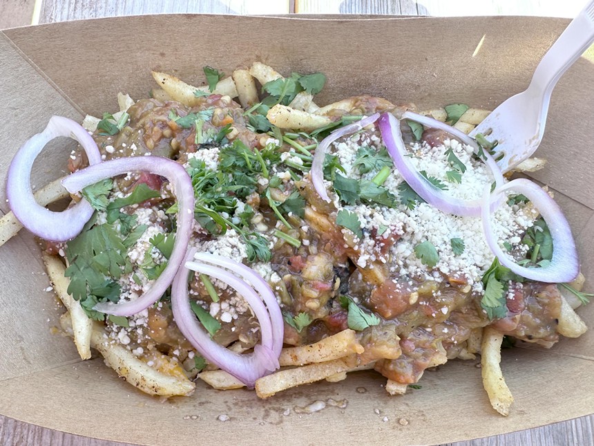 fries topped with green chile, onion, cilantro and cotija