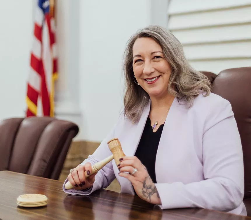 City councilwoman at desk
