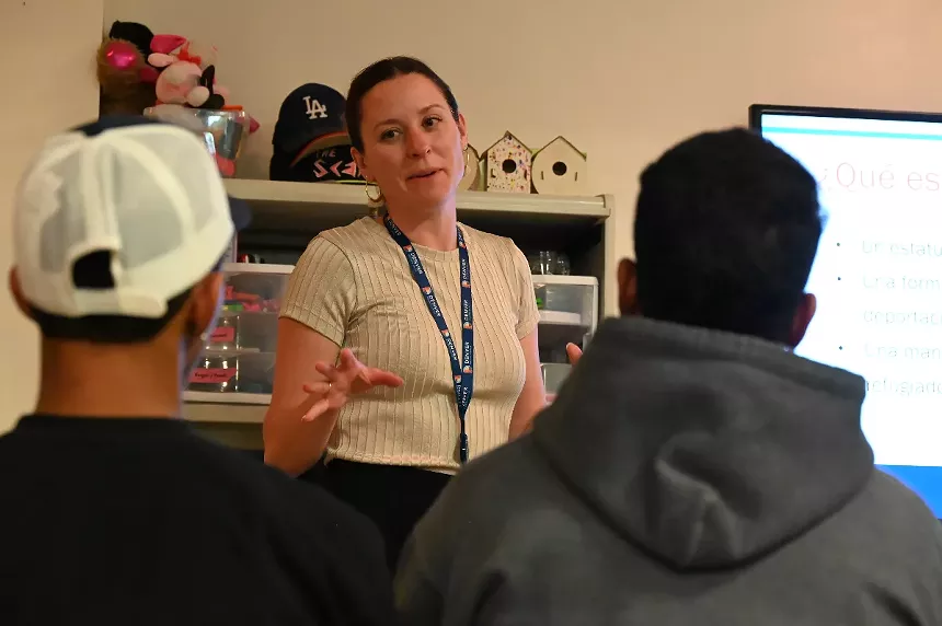 A woman speaks to a group.
