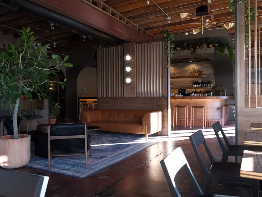 various chairs and couches inside a bar