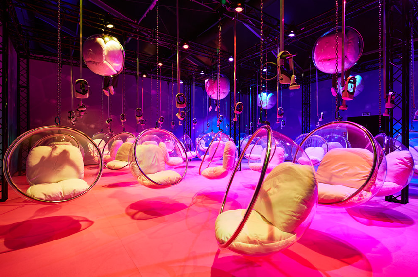 circular chairs hanging from a ceiling