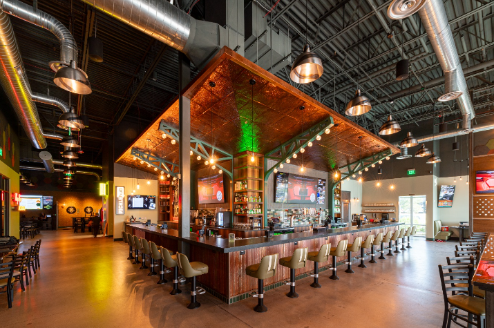 a bar lined with empty stools