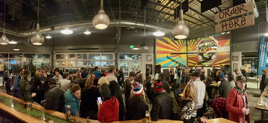 A brewery packed with patrons.