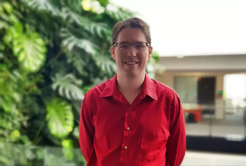 man in a red button-down shirt
