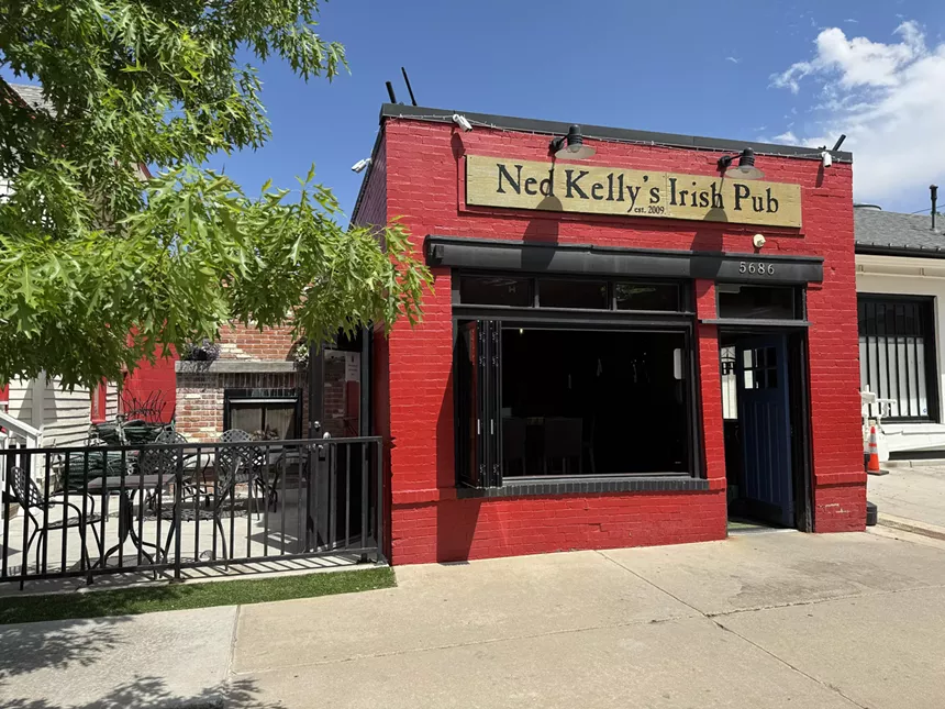 front of a red building