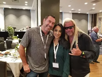 Dog the Bounty Hunter takes a photo with friends