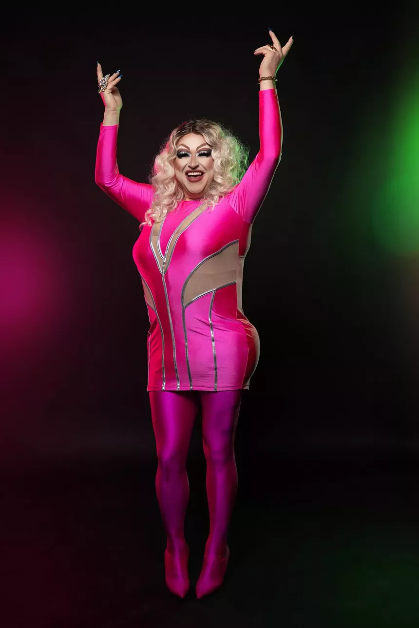 drag queen in fuschia outfit