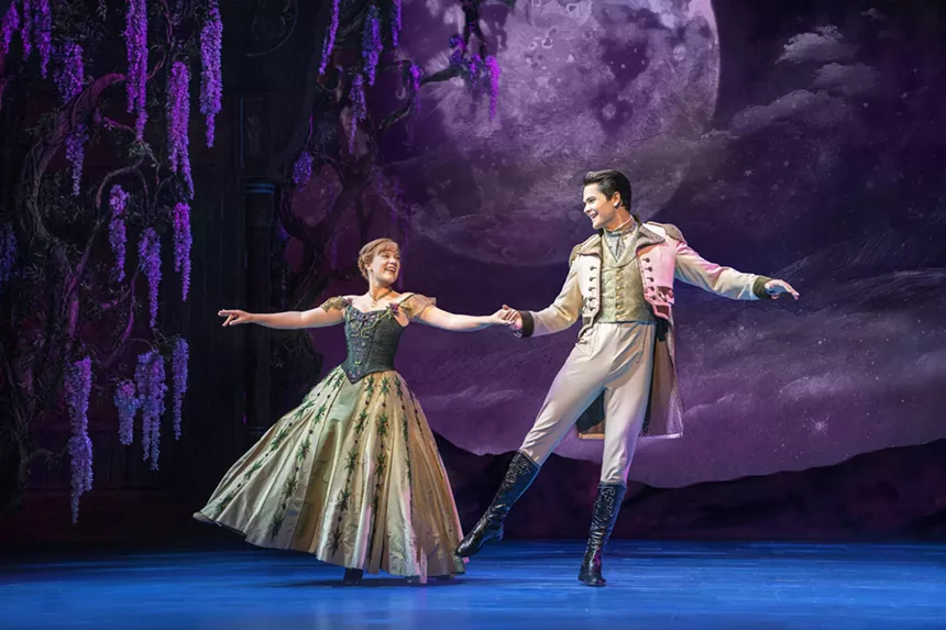 woman and man dancing in the production of Frozen