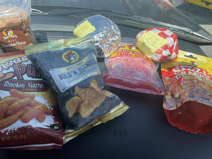 various bags of snacks and fast food-style sandwiches