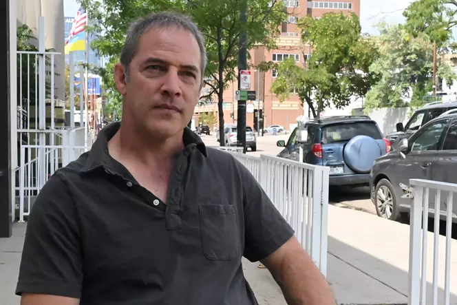 Man in black shirt outside